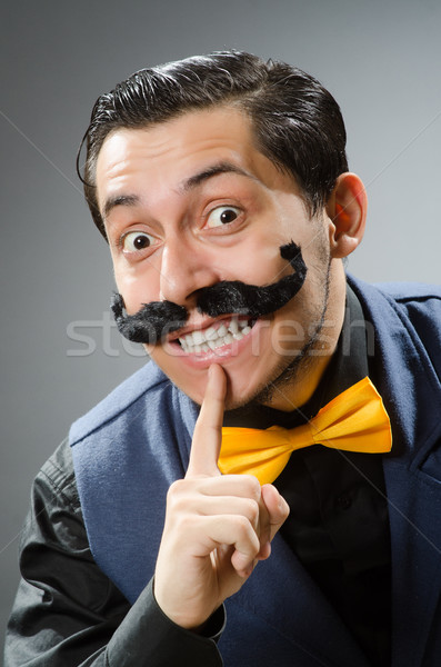 Funny man against dark background Stock photo © Elnur
