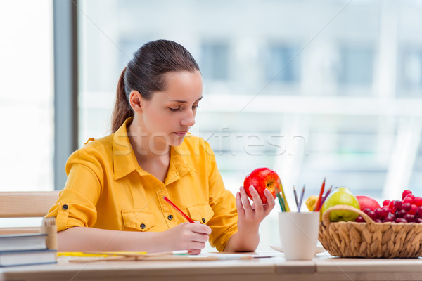 Young school gilr drawing pictures at home Stock photo © Elnur