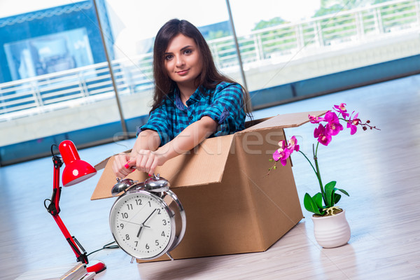 Young woman moving personal belongings Stock photo © Elnur