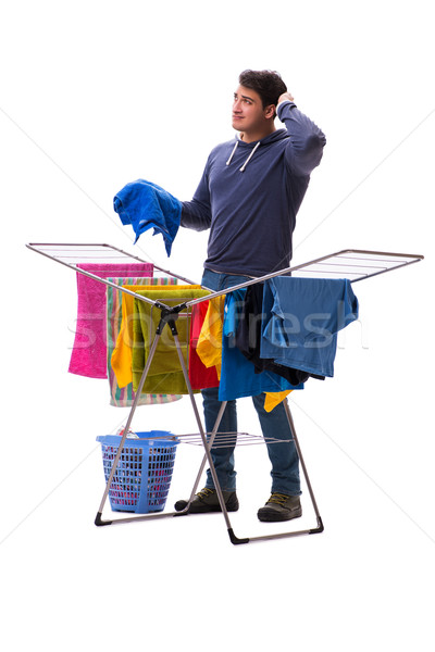 The husband man doing laundry isolated on white Stock photo © Elnur