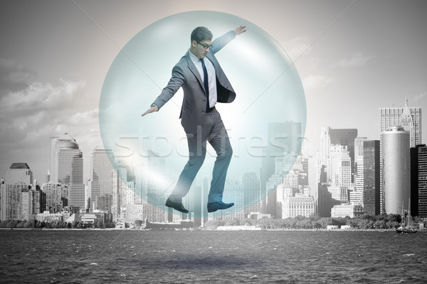 Businessman flying inside the bubble Stock photo © Elnur