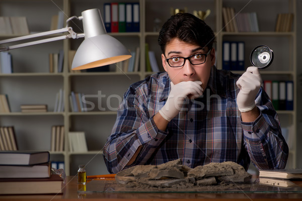 Stock photo: Archeologist working late night in office
