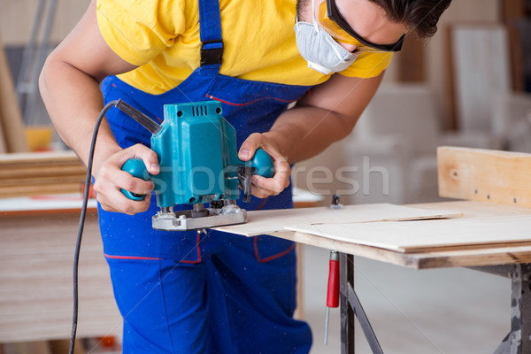 Carpenter working in the workshop Stock photo © Elnur
