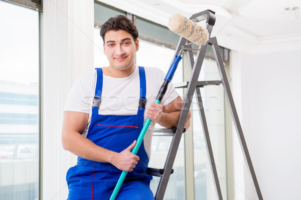 The painter repairman working at construction site Stock photo © Elnur