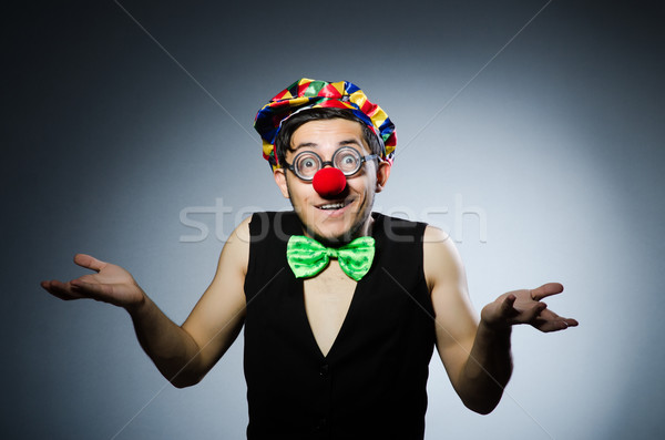 Funny clown against the dark background Stock photo © Elnur