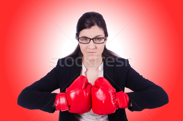 Woman businesswoman with boxing gloves on white Stock photo © Elnur
