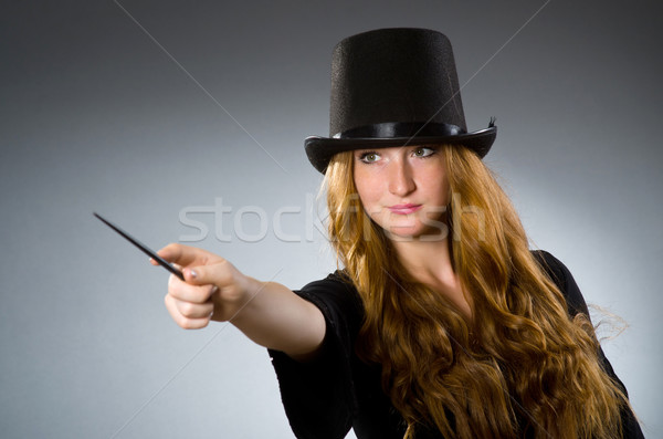 Woman magician doing her tricks with wand Stock photo © Elnur