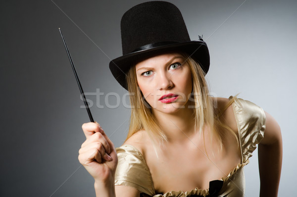 Woman magician with magic wand and hat Stock photo © Elnur