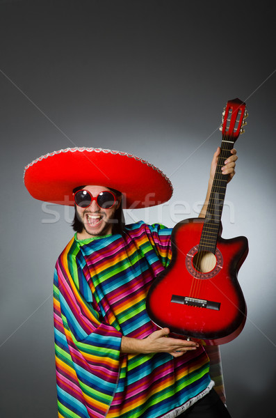 Man wearing sombrero in dark studio Stock photo © Elnur