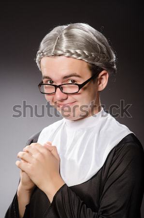 Funny man wearing nun clothing Stock photo © Elnur