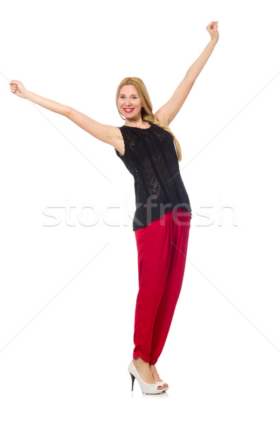 Tall young woman in red pants isolated on white Stock photo © Elnur