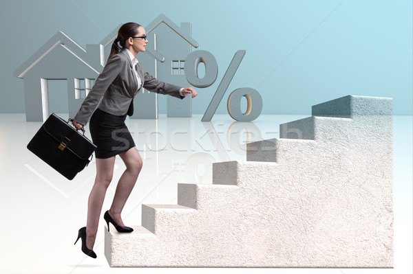 Businesswoman walking climbing stairs in mortgage Stock photo © Elnur