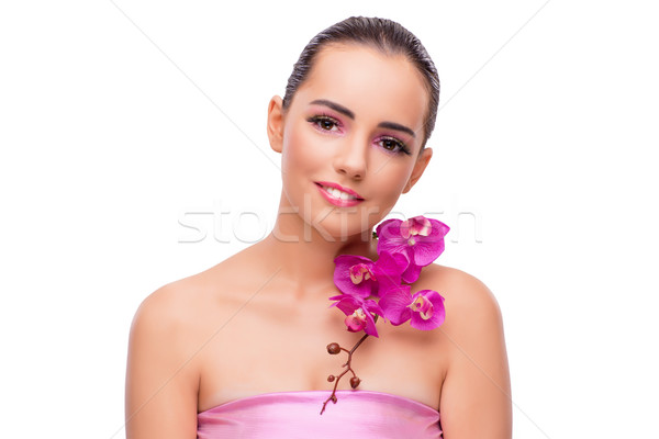 Beautiful woman with orchid flower isolated on white Stock photo © Elnur