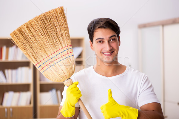 Man husband cleaning home in family concept Stock photo © Elnur