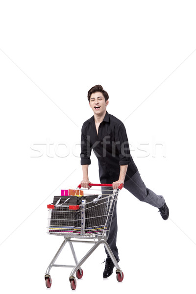 Young man with shopping cart and bags isolated on white Stock photo © Elnur