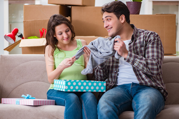 The young couple of man and pregnant wife with giftbox Stock photo © Elnur
