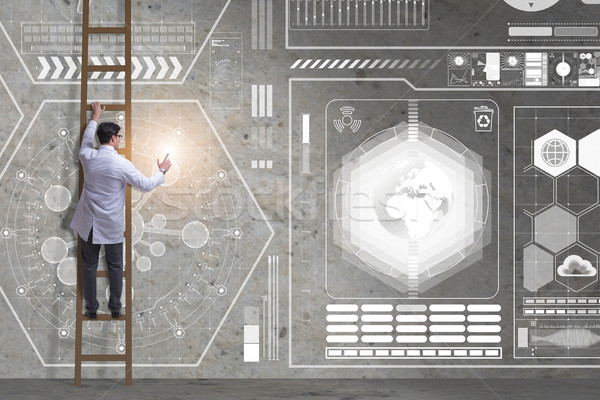 Male doctor climbing ladder in medical concept Stock photo © Elnur