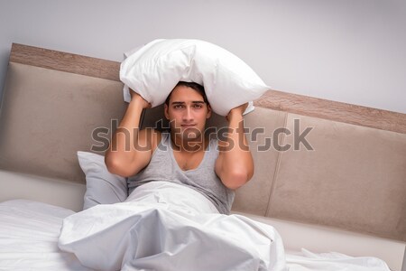 The young sexy man wearing santa hat in bed Stock photo © Elnur