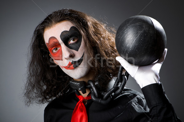Clown with shackles in studio Stock photo © Elnur