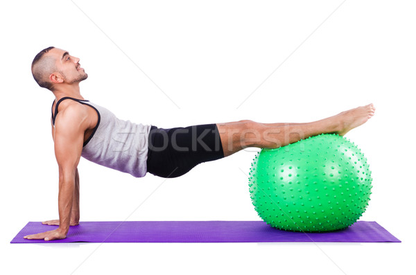 Man with swiss ball doing exercises on white Stock photo © Elnur