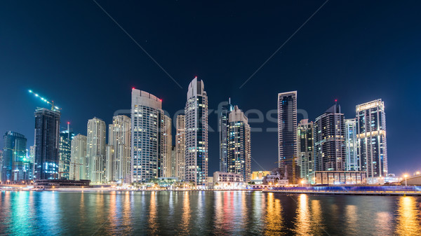 Dubai marina skyscrapers during night hours Stock photo © Elnur