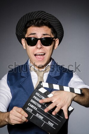 Jonge man cool zonnebril pistool geïsoleerd Stockfoto © Elnur
