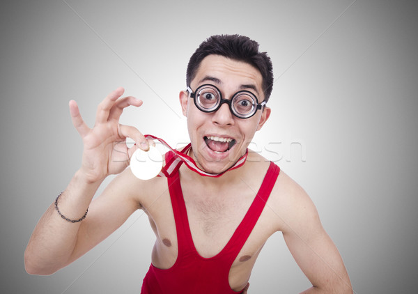 Stock photo: Funny wrestler with winners medal