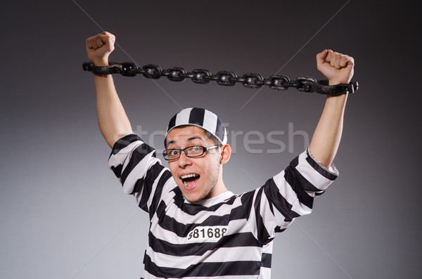 Young prisoner against gray Stock photo © Elnur