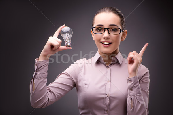 Stock photo: Businesswoman with lightbulb in business concept