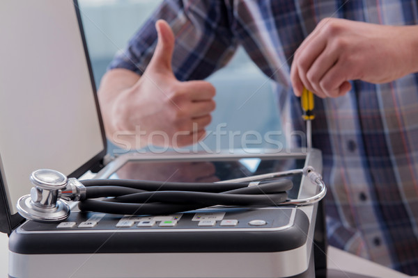 The repairman repairing broken color printer Stock photo © Elnur