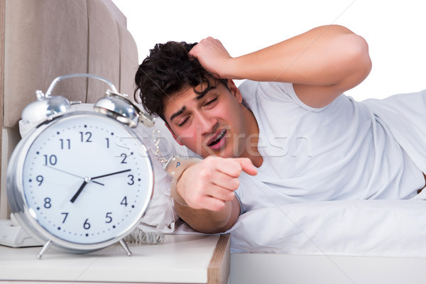 Homme lit souffrance insomnie horloge dormir [[stock_photo]] © Elnur