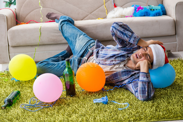 Man having hangover after christmas party Stock photo © Elnur