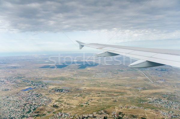 Stock photo: Airplane wing out of window