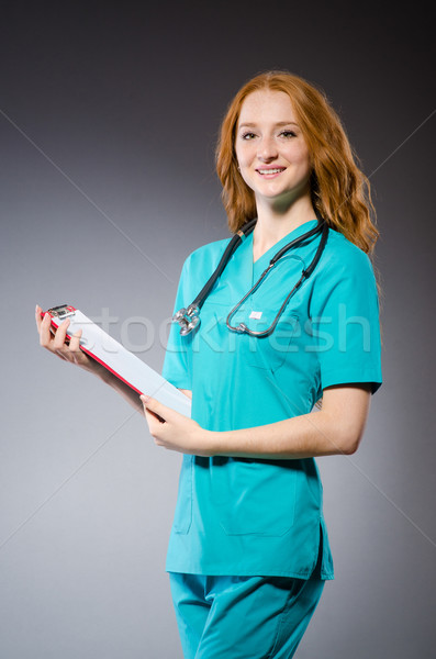 Woman doctor with paper notepad  Stock photo © Elnur