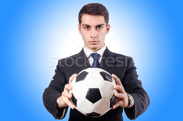 Young businessman with football on white Stock photo © Elnur