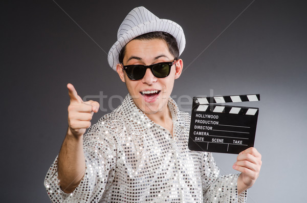 Young camera assistant with clapperboard Stock photo © Elnur