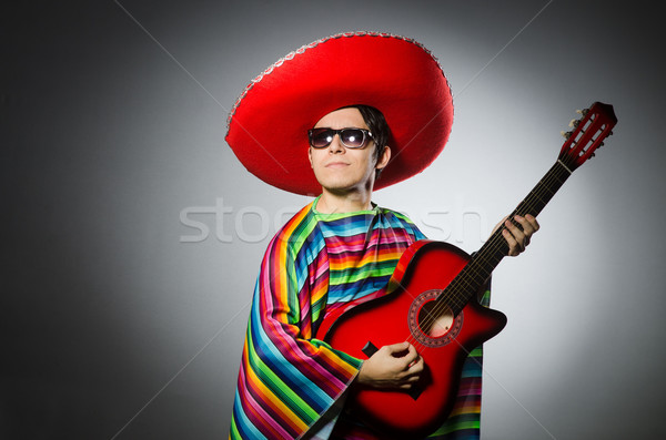 Man in red sombrero playing guitar Stock photo © Elnur