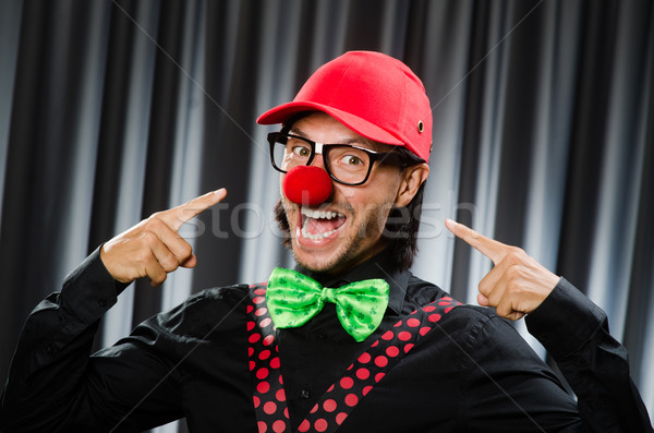 Stock photo:  Funny clown in humorous concept against curtain