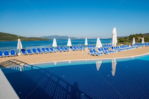 Nice swimming pool outdoors on bright summer day Stock photo © Elnur