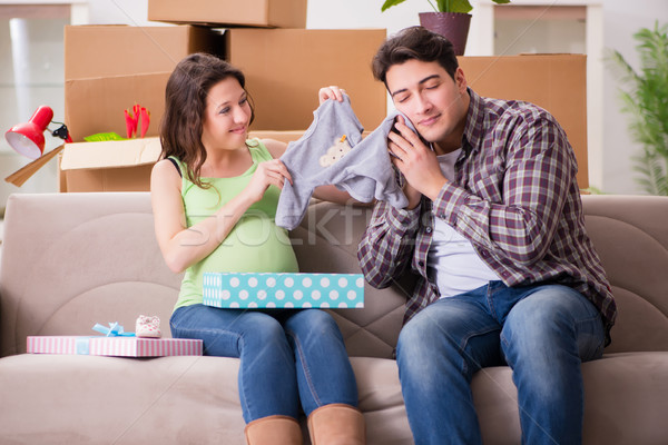 Young couple of man and pregnant wife with giftbox Stock photo © Elnur