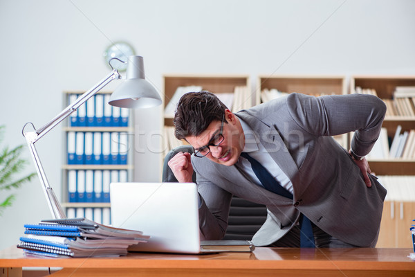 Stock photo: Businessman feeling pain in the office