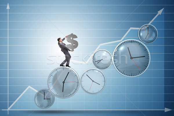 Time is money concept with businessman holding dollar Stock photo © Elnur
