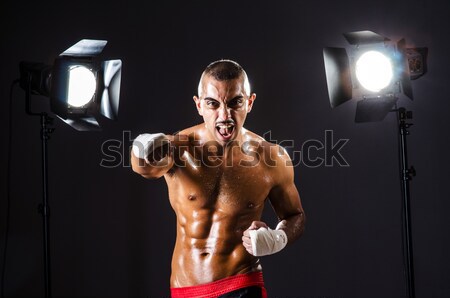 Muscular actor with mask against curtain Stock photo © Elnur