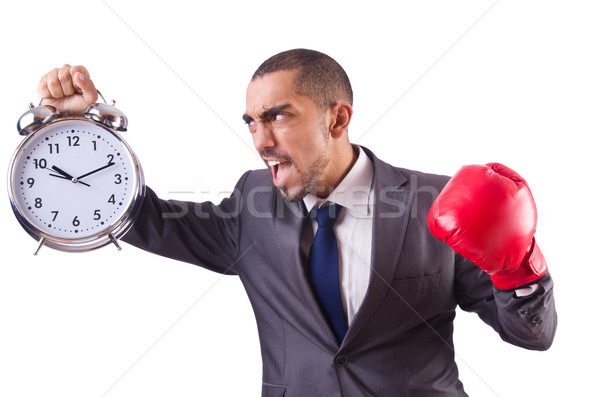 Angry businessman hitting clock isolated on white Stock photo © Elnur