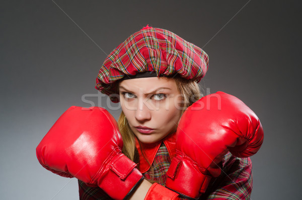 Woman in scottish clothing in boxing concept Stock photo © Elnur