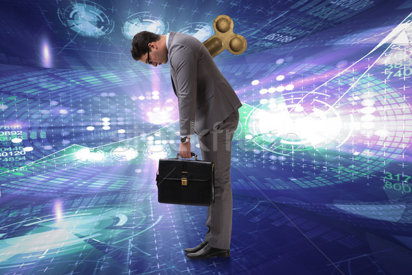 Businessman with key in hardworking concept Stock photo © Elnur