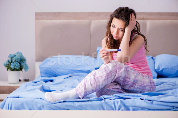 Woman upset with pregnancy test results Stock photo © Elnur