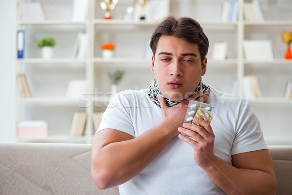 Young man suffering from sore throat Stock photo © Elnur