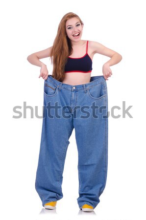 Woman in dieting concept with big jeans Stock photo © Elnur