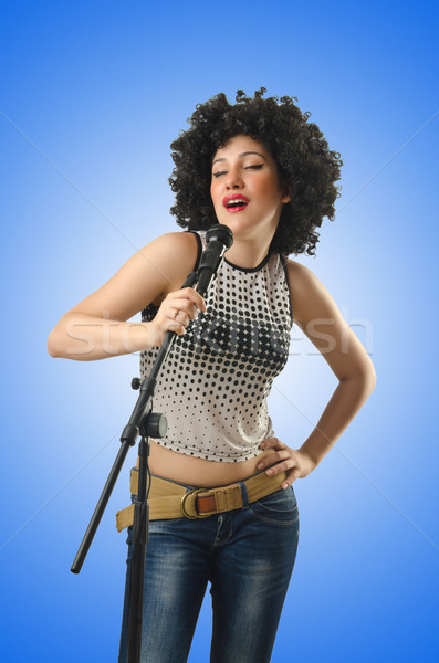 Woman with afro haircut on white Stock photo © Elnur